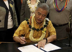 Governor Ige signing the bill into law